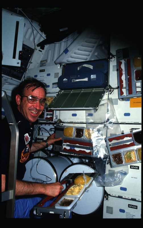 fabian aboard sts-51g about to enjoy one of his meals