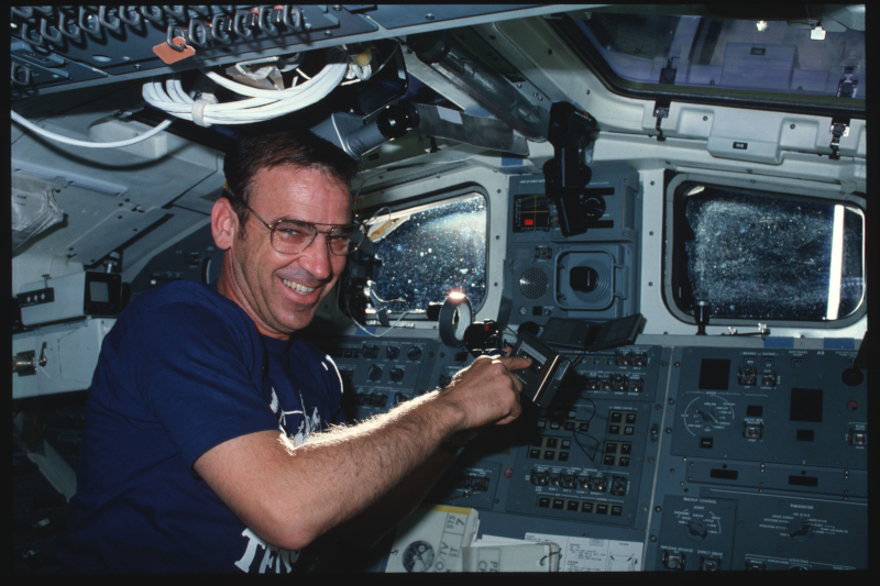aboard sts-7, Fabian points to the tape in the recorder he is using
