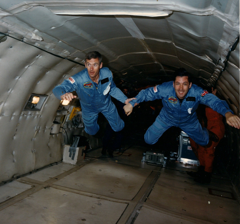 UK Skynet Payload Specilaists Nigel Wood and Richard Farrimond get a taste of zero gravity, floating in the NASA KC-135 training aircraft