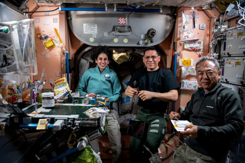 in the Unity module ofthe ISS, Expedition 69 Flight Engineers Moghbeli, Rubio (both NASA) and Furukawa (JAXA) come together to have lunch