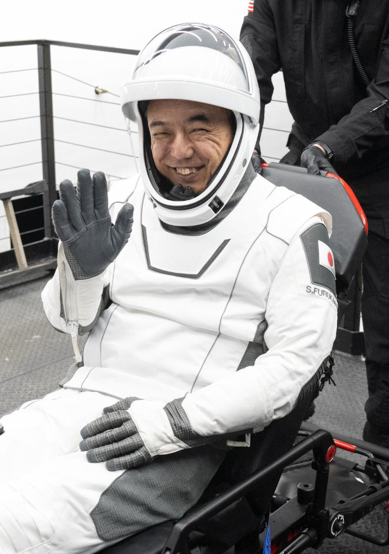 a smiling and waving Furukawa is helped from the SpaceX Dragon spacecraft at the end of his six-month stay aboard ISS on Expedition 69/70 in 2023/4