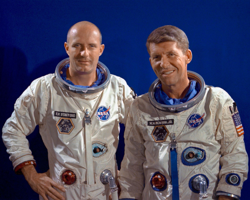 The Gemini 6 crew pose during a suiting up exercise