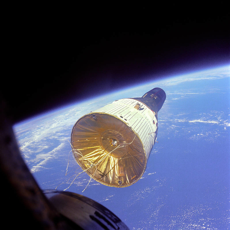 The gemini 6 spacecraft is photographed in Earth orbit by the crew of the nearby Gemini 7 vehicle