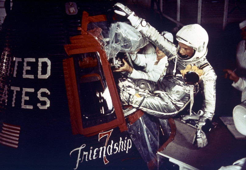a silver-suited Glenn is helped into his Mercury capsule  Friendship 7 on launch day