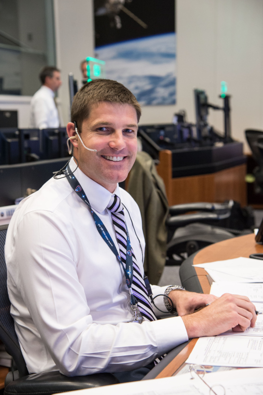A smiling Jeremy Hansen at the Capcom console during  ISS Expedition 47 in 2016