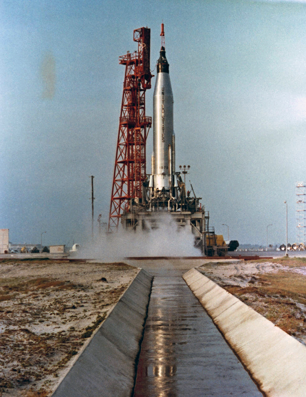 Ignition and the Atlas rocket carrying Carpenter lifts off from the launch pad in Florida