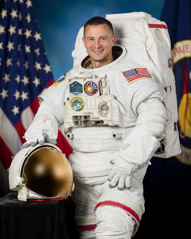 official portrait of Drew Morgan wearing his EVA spacesuit