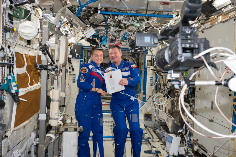 Cosmonauts Elena Serova and Aleksandr Samokutyaev are seen during a broadcast interview aboard ISS.
