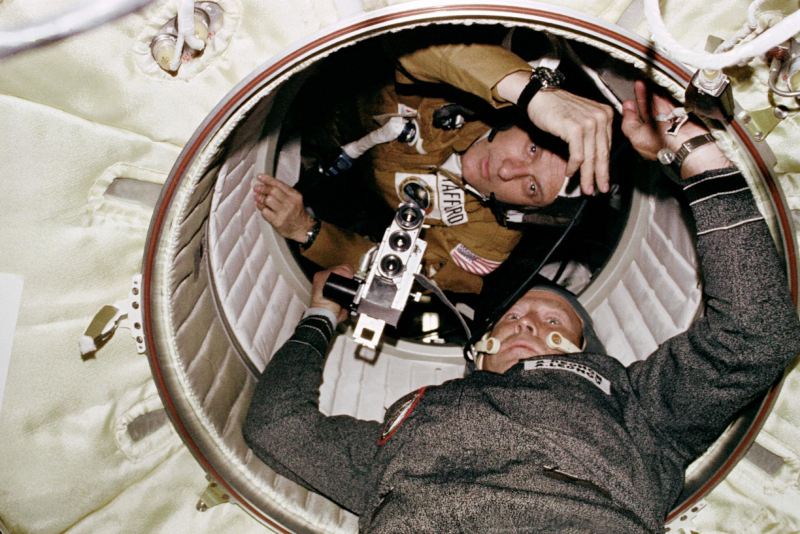 Historic meeting between Stafford and cosmonaut Alexei LEonov in the hatchway between the Apollo-Soyuz spacecraft
